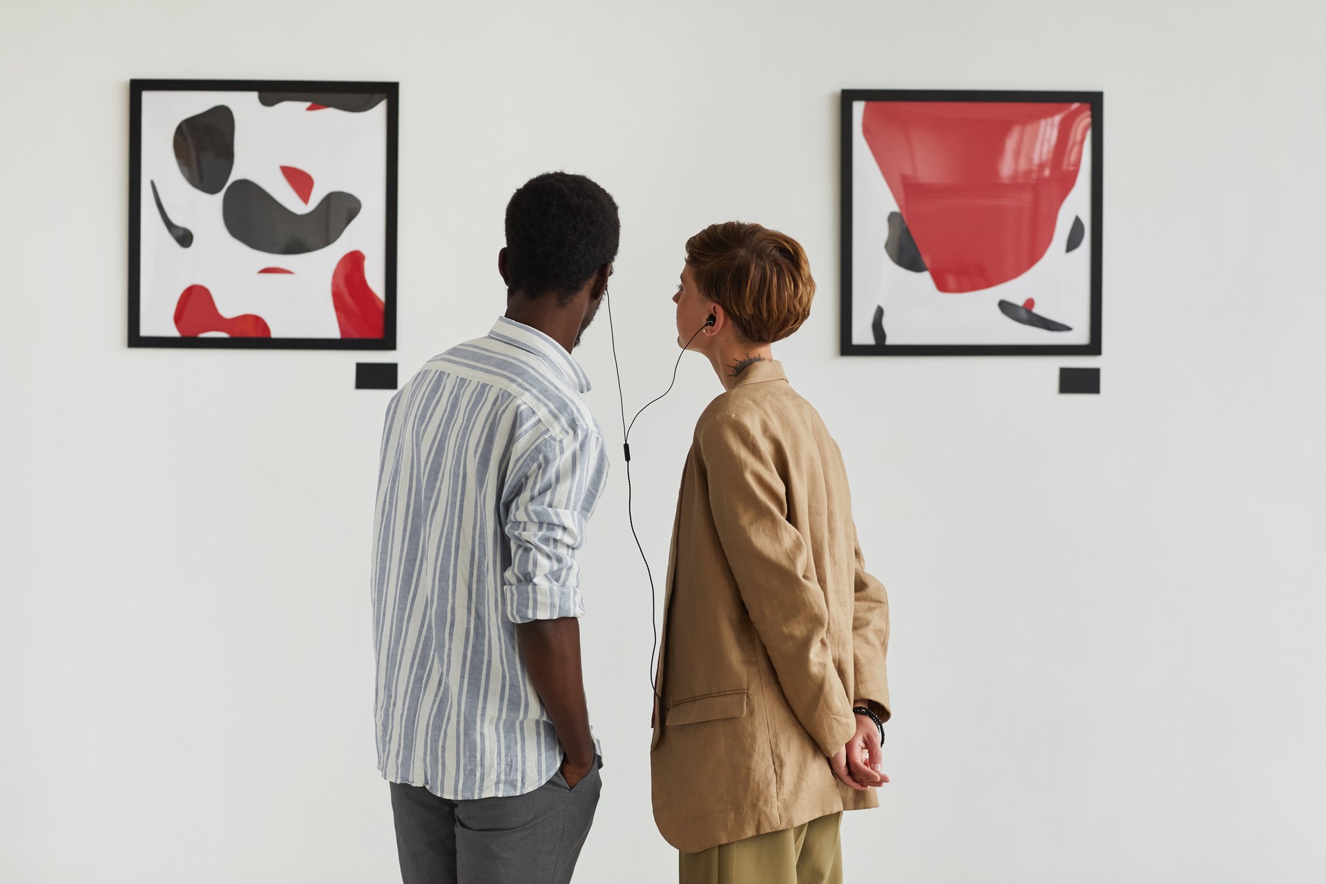 Couple Looking at Modern Art in Museum